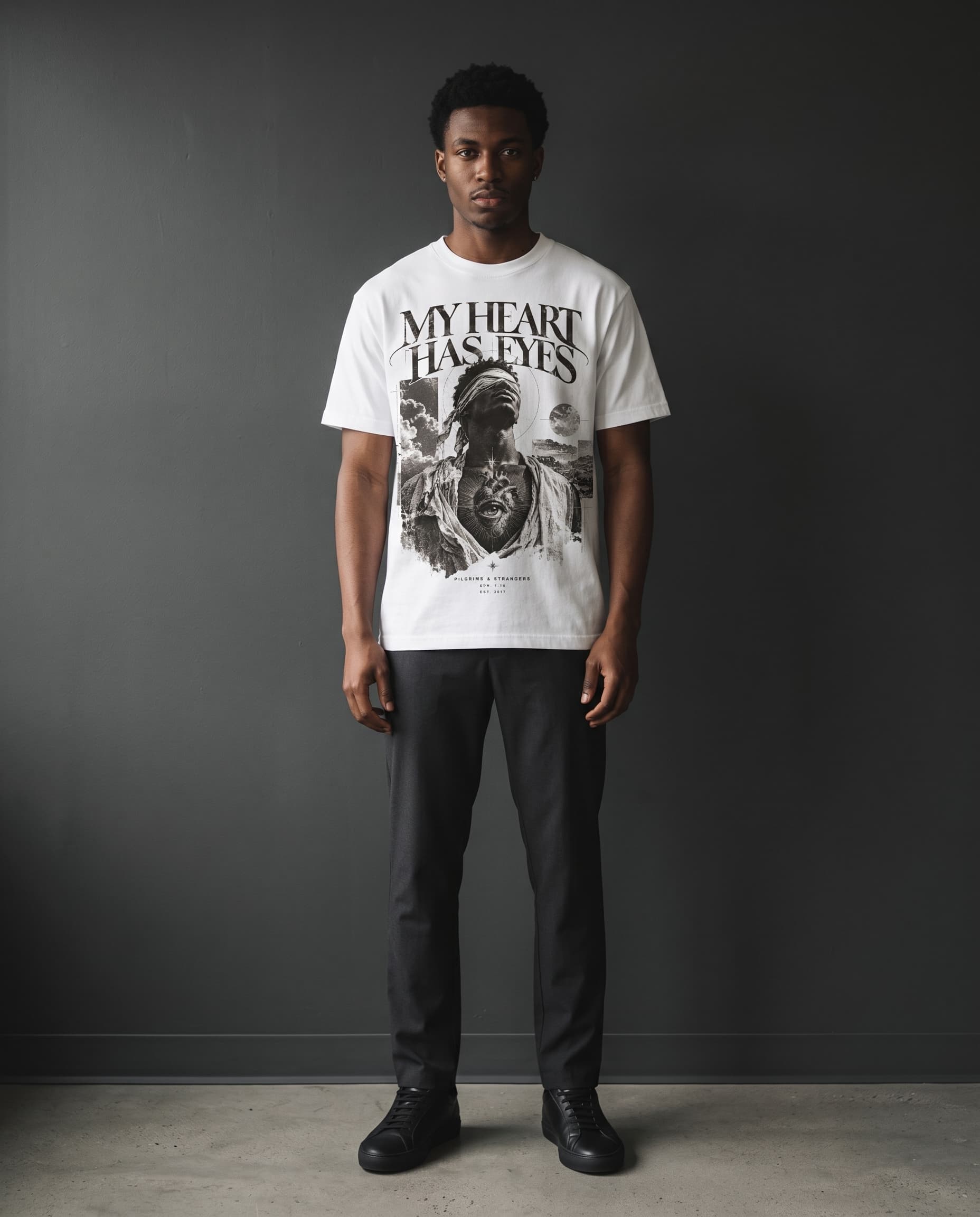 Model wearing the white My Heart Has Eyes tee